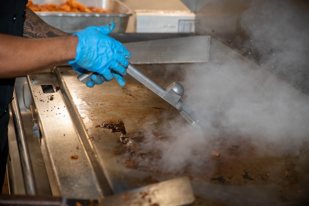 Ronald Reagan Sailors Prepare Food For Opening Of Ships Galley