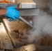 Ronald Reagan Sailors Prepare Food For Opening Of Ships Galley