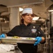 Ronald Reagan Sailors Prepare Food For Opening Of Ships Galley