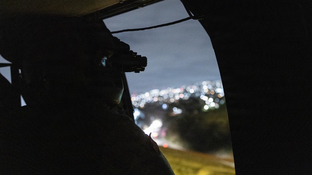 U.S. Service Members with JTF-SB Fly into Nighttime Reconnaissance mission