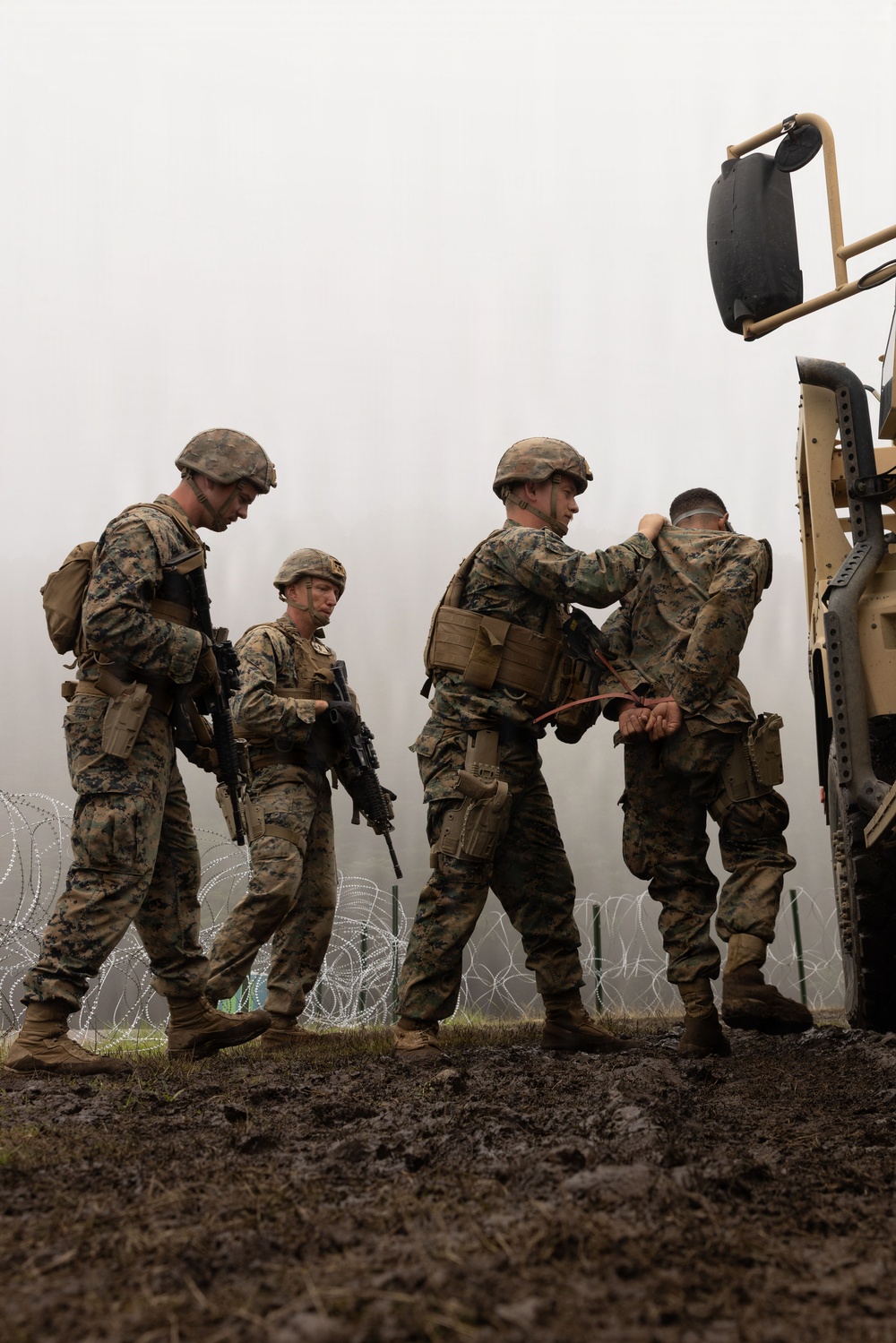 HIJUDAI MANEUVER AREA. OITA, JAPAN – U.S. Marines with 4th LE Demonstrate Techniques for Detainee Handling During Exercise Resolute Dragon 26