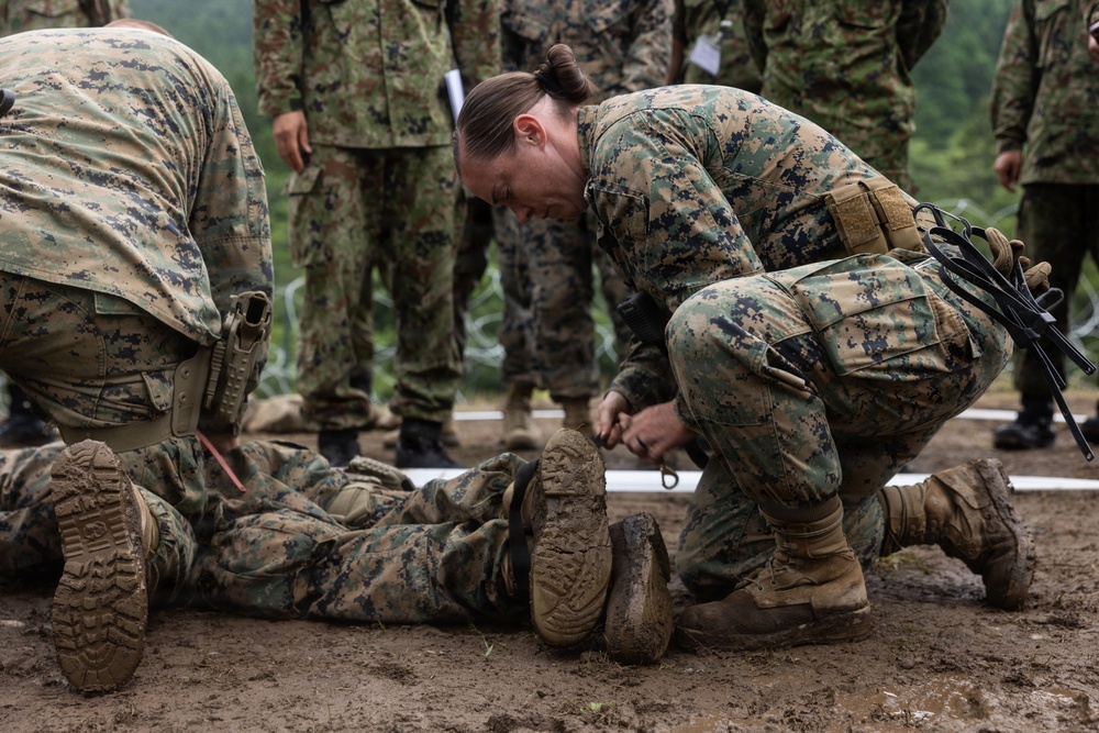 HIJUDAI MANEUVER AREA. OITA, JAPAN – U.S. Marines with 4th LE Demonstrate Techniques for Detainee Handling During Exercise Resolute Dragon 26