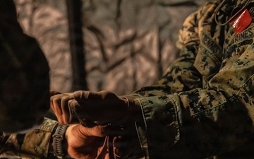 HIJUDAI MANEUVER AREA. OITA, JAPAN – U.S. Marines with 4th LE Demonstrate Techniques for Detainee Handling During Exercise Resolute Dragon 26