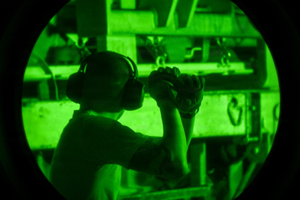 Air transportation specialists unload cargo within the U.S. Central Command area of responsibility