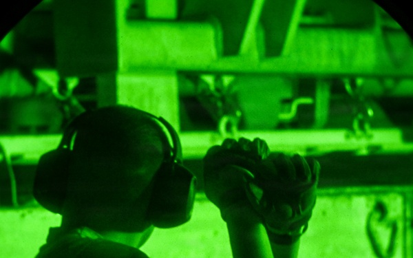 Air transportation specialists unload cargo within the U.S. Central Command area of responsibility