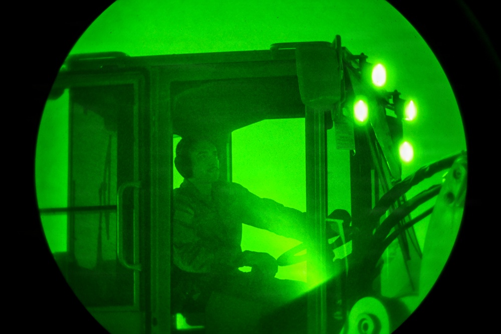 Air transportation specialists unload cargo within the U.S. Central Command area of responsibility