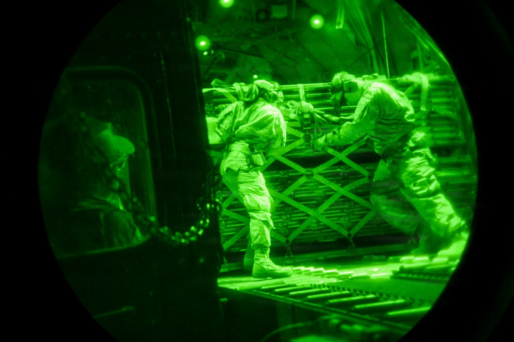 Air transportation specialists unload cargo within the U.S. Central Command area of responsibility