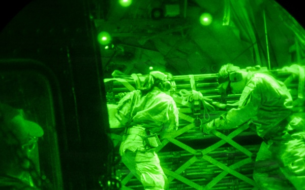 Air transportation specialists unload cargo within the U.S. Central Command area of responsibility