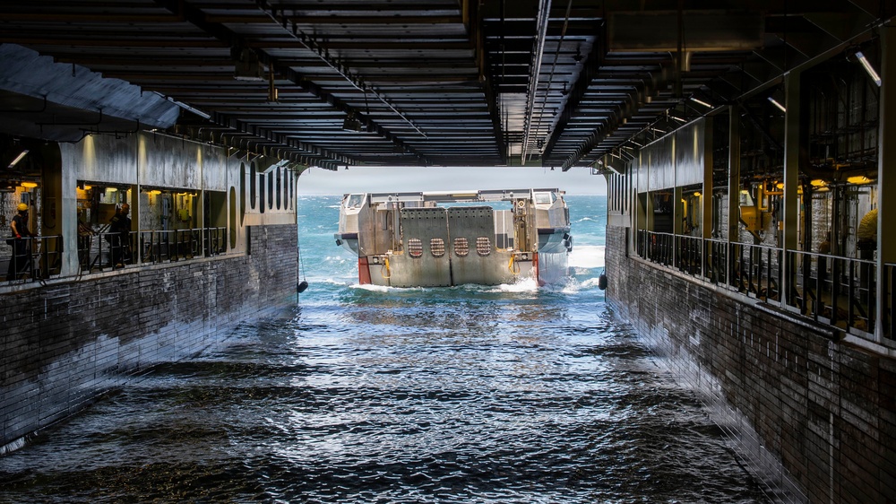 A French landing L-CAT, pulls aboard the Mistral-class amphibious assault ship FS Dixmude