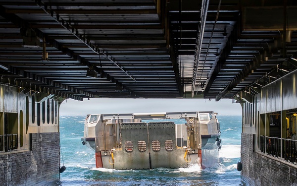 A French landing L-CAT, pulls aboard the Mistral-class amphibious assault ship FS Dixmude