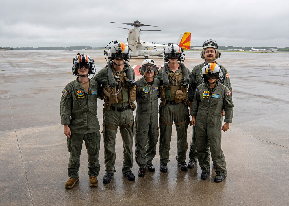 Vice Adm. Doug Perry, commander, U.S. 2nd Fleet, takes a photo with U.S. Navy Sailors from Fleet Logistics Multi-Mission Squadron (VRM) 40