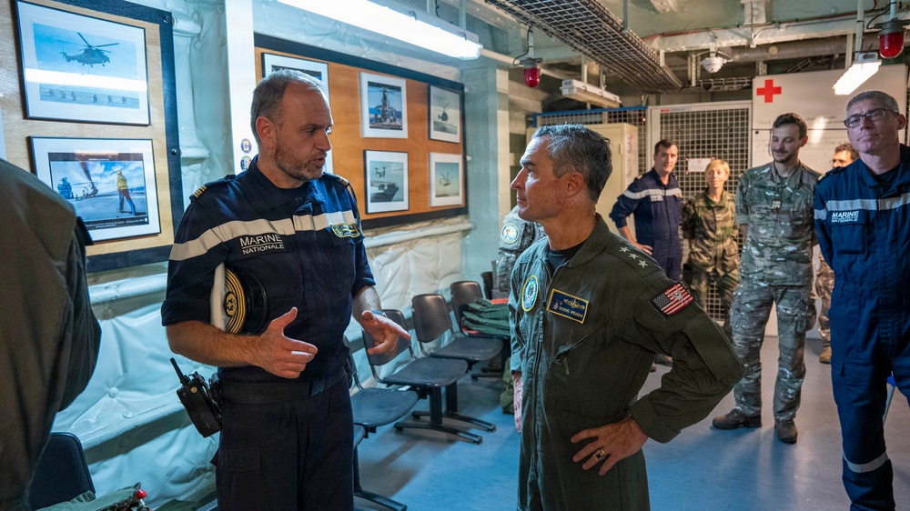 Vice Adm. Doug Perry, commander, U.S. 2nd Fleet, speaks with French navy Capt. Jocelyn Delrieu