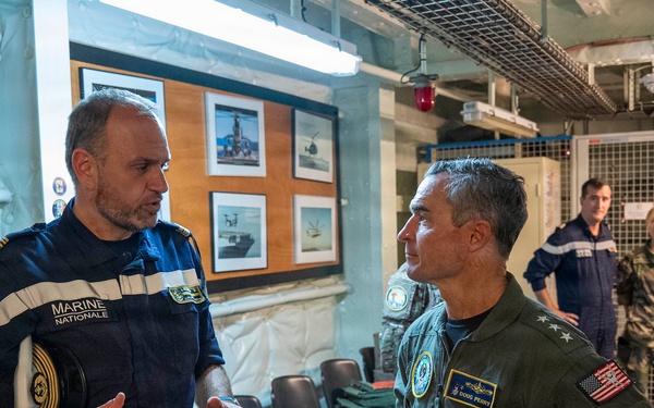 Vice Adm. Doug Perry, commander, U.S. 2nd Fleet, speaks with French navy Capt. Jocelyn Delrieu