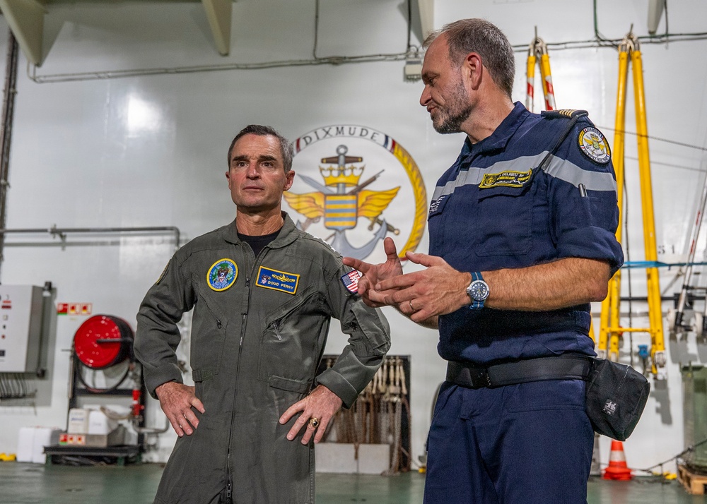 Vice Adm. Doug Perry, commander, U.S. 2nd Fleet, speaks with French navy Capt. Jocelyn Delrieu