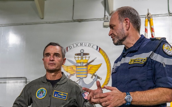 Vice Adm. Doug Perry, commander, U.S. 2nd Fleet, speaks with French navy Capt. Jocelyn Delrieu