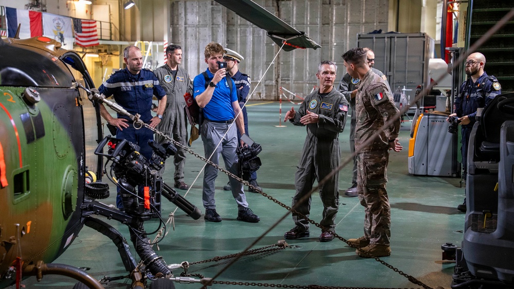 Vice Adm. Doug Perry, commander, U.S. 2nd Fleet, speaks to a French navy sailor
