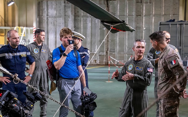 Vice Adm. Doug Perry, commander, U.S. 2nd Fleet, speaks to a French navy sailor