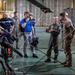 Vice Adm. Doug Perry, commander, U.S. 2nd Fleet, speaks to a French navy sailor