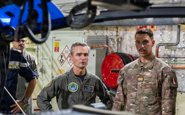 Vice Adm. Doug Perry, commander, U.S. 2nd Fleet, speaks to a French navy sailor