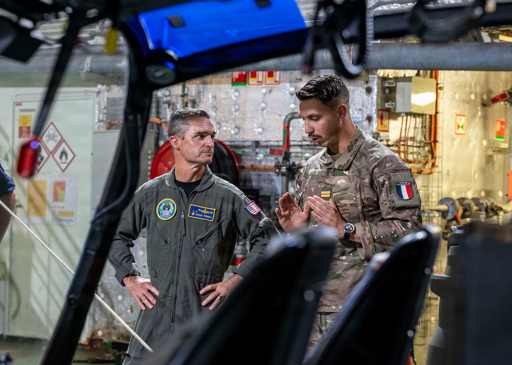 Vice Adm. Doug Perry, commander, U.S. 2nd Fleet, speaks to a French navy sailor
