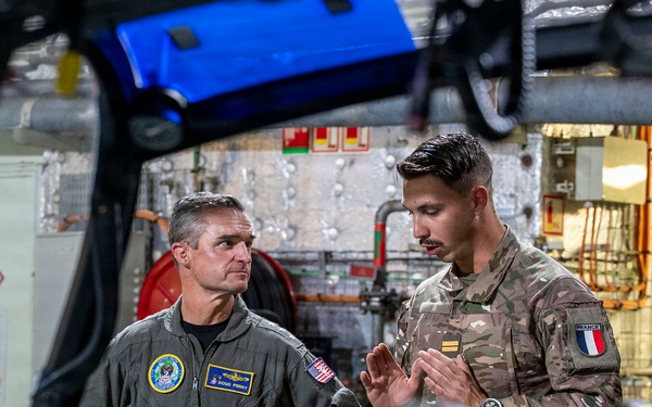 Vice Adm. Doug Perry, commander, U.S. 2nd Fleet, speaks to a French navy sailor