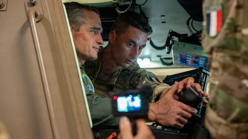 Vice Adm. Doug Perry, commander, U.S. 2nd Fleet, speaks to a French navy sailor