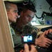 Vice Adm. Doug Perry, commander, U.S. 2nd Fleet, speaks to a French navy sailor