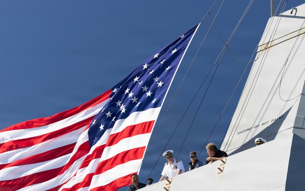 U.S. Marines and Sailors man the rails aboard the USS Arlington (LPD-24)