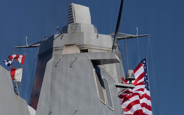 U.S. Marines and Sailors man the rails aboard the USS Arlington (LPD-24)