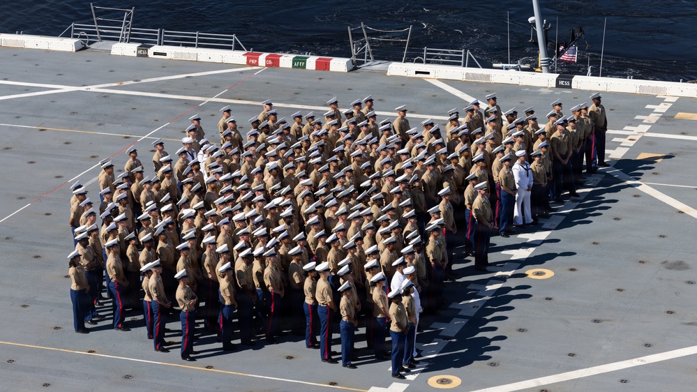 U.S. Marines and Sailors man the rails aboard the USS Arlington (LPD-24)