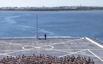 U.S. Marines and Sailors man the rails aboard the USS Arlington (LPD-24)