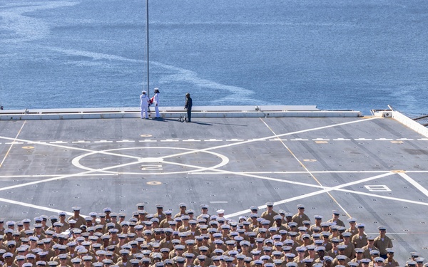U.S. Marines and Sailors man the rails aboard the USS Arlington (LPD-24)