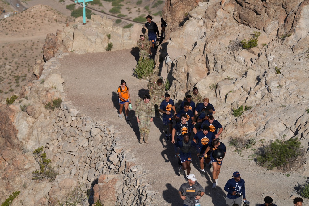 Side‑by‑side: Soldiers and UTEP football players tackle Mt. Cristo Rey
