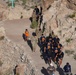 Side‑by‑side: Soldiers and UTEP football players tackle Mt. Cristo Rey