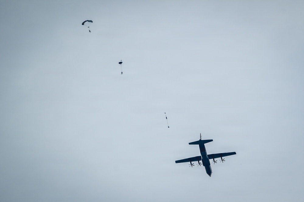 U.S. Navy personnel conduct airborne training over Yokota Air Base