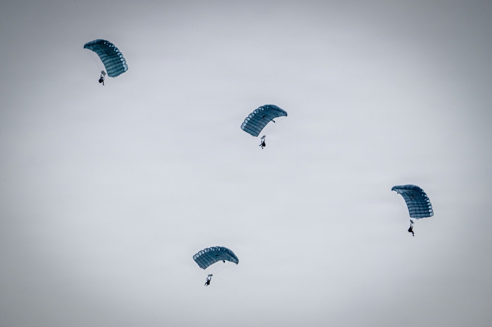 U.S. Navy personnel conduct airborne training over Yokota Air Base