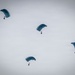 U.S. Navy personnel conduct airborne training over Yokota Air Base
