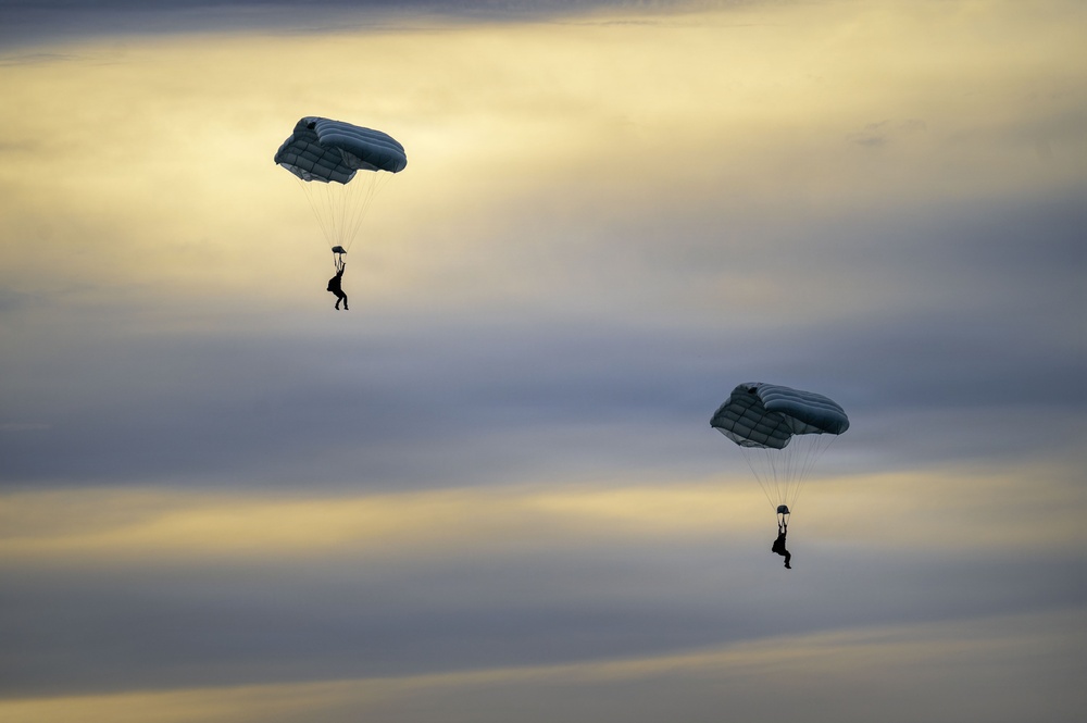 U.S. Navy personnel conduct airborne training over Yokota Air Base