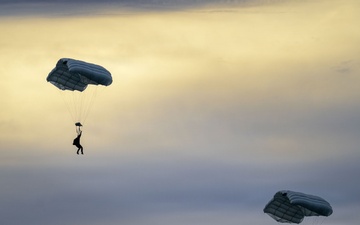 U.S. Navy personnel conduct airborne training over Yokota Air Base
