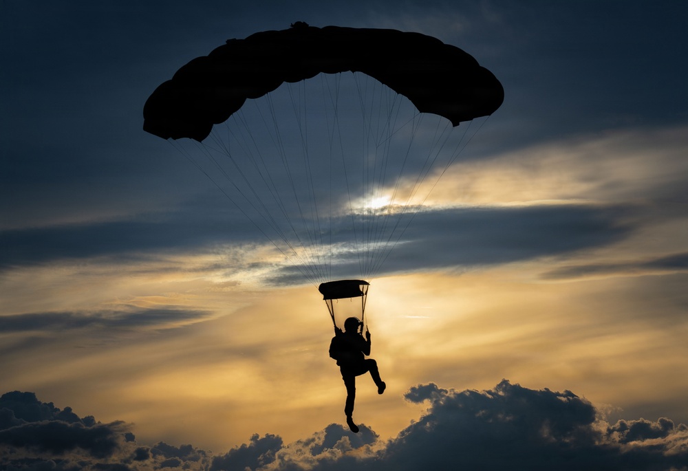 U.S. Navy personnel conduct airborne training over Yokota Air Base