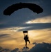 U.S. Navy personnel conduct airborne training over Yokota Air Base