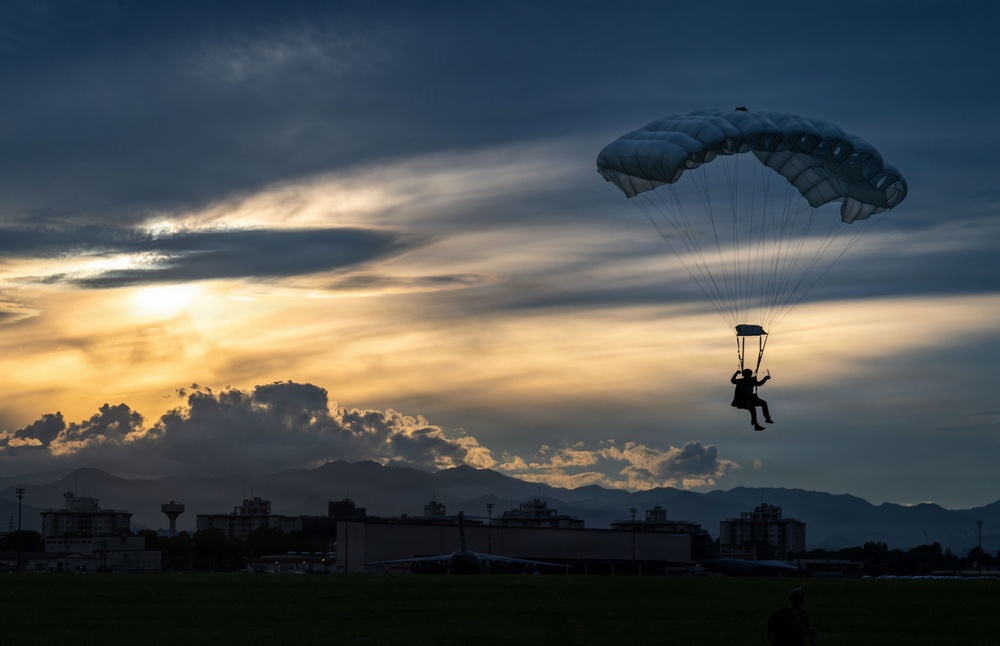 U.S. Navy personnel conduct airborne training over Yokota Air Base