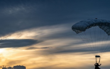 U.S. Navy personnel conduct airborne training over Yokota Air Base