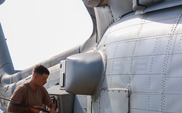 John Finn Conducts Pre-flight Inspections