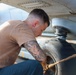 John Finn Conducts Pre-flight Inspections