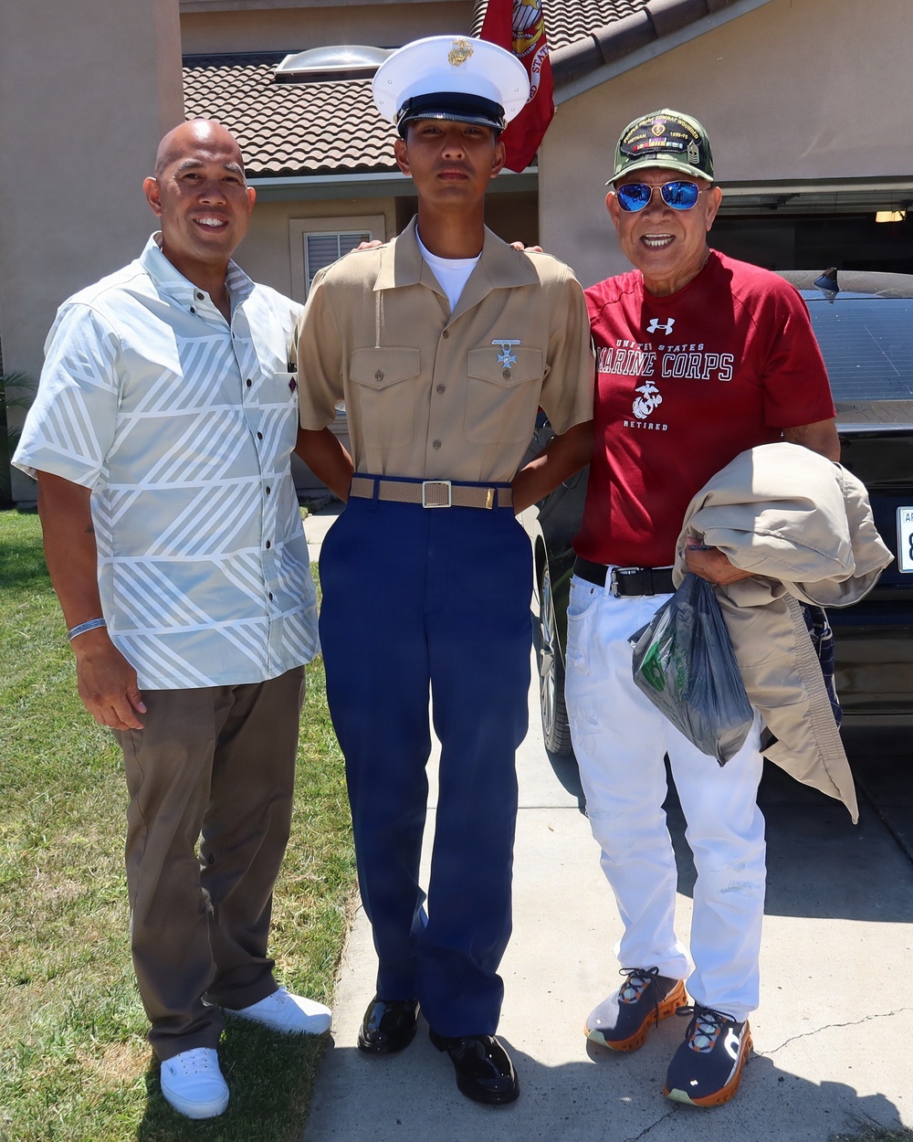 3 generations of Ventura family Marines pose for commemorative photo