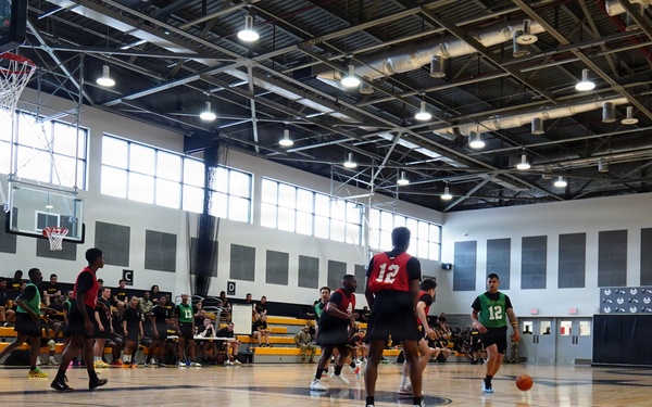 Basketball teams battle for the win