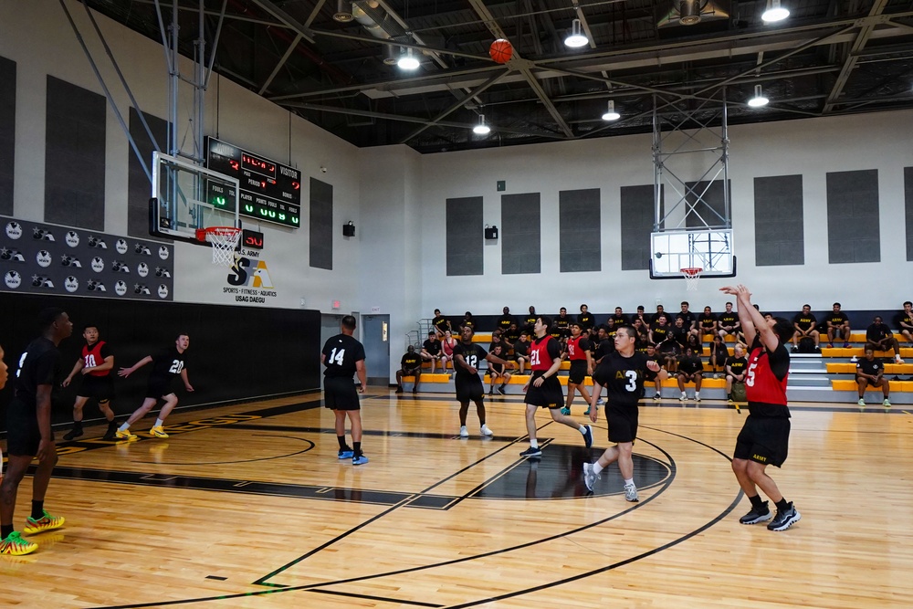 Basketball teams battle for the win