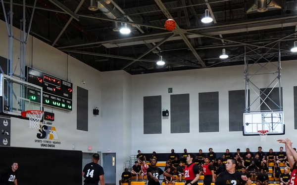 Basketball teams battle for the win