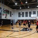 Basketball teams battle for the win